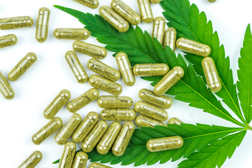 Several CBD capsules spread out for display